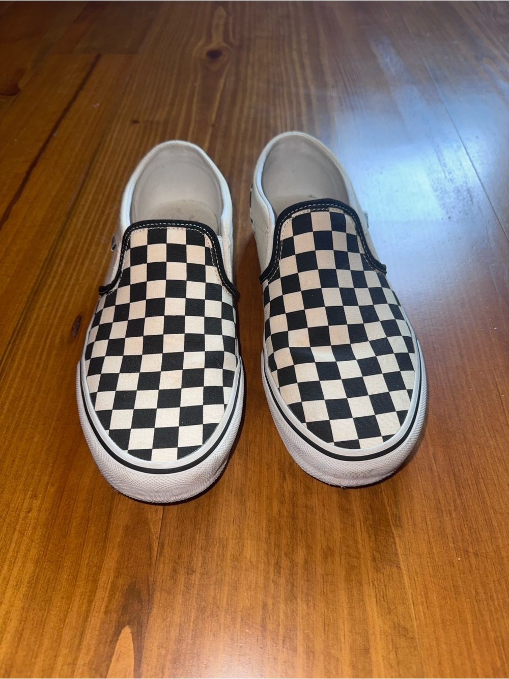 Women’s Black and White Checker Slip-On Canvas Sneakers